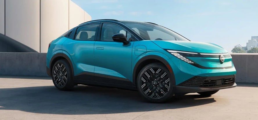 A bright blue 2026 Nissan Leaf SUV