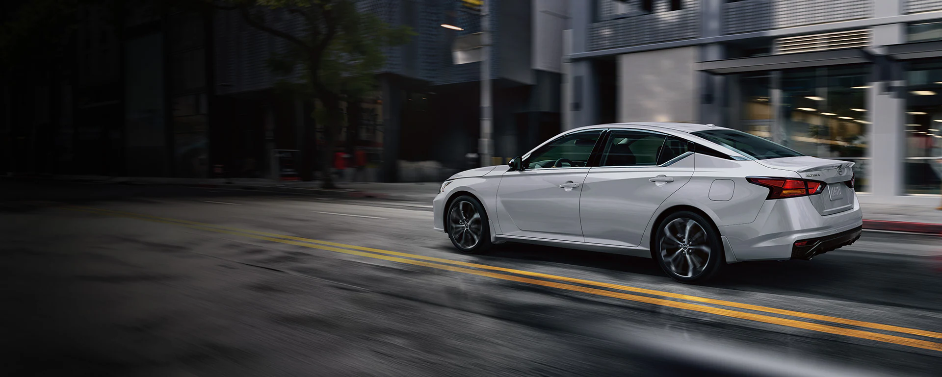 Nissan Altima driving through traffic